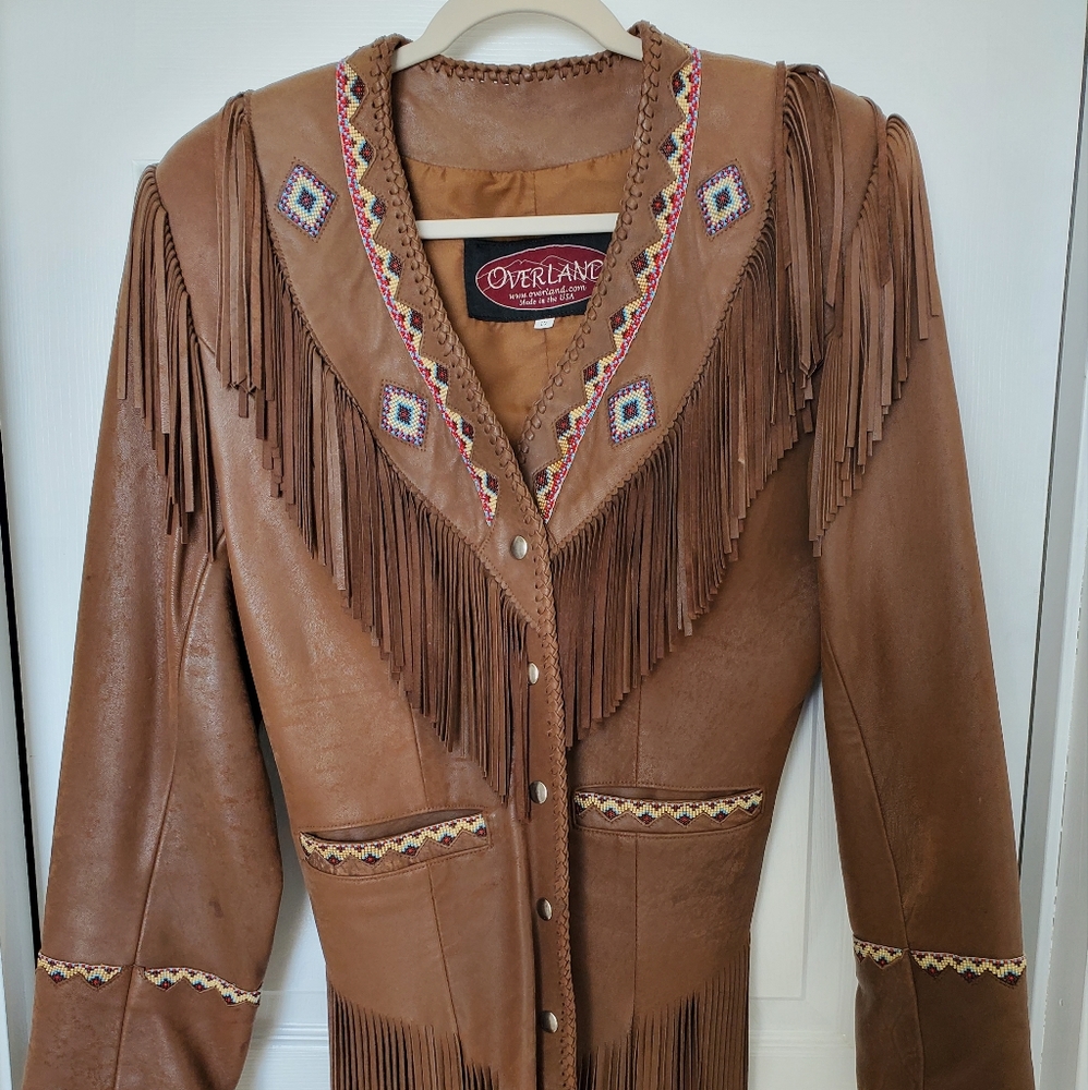 Leather beaded and fringed jacket size 10, fitted.  No missing beads or fringe.